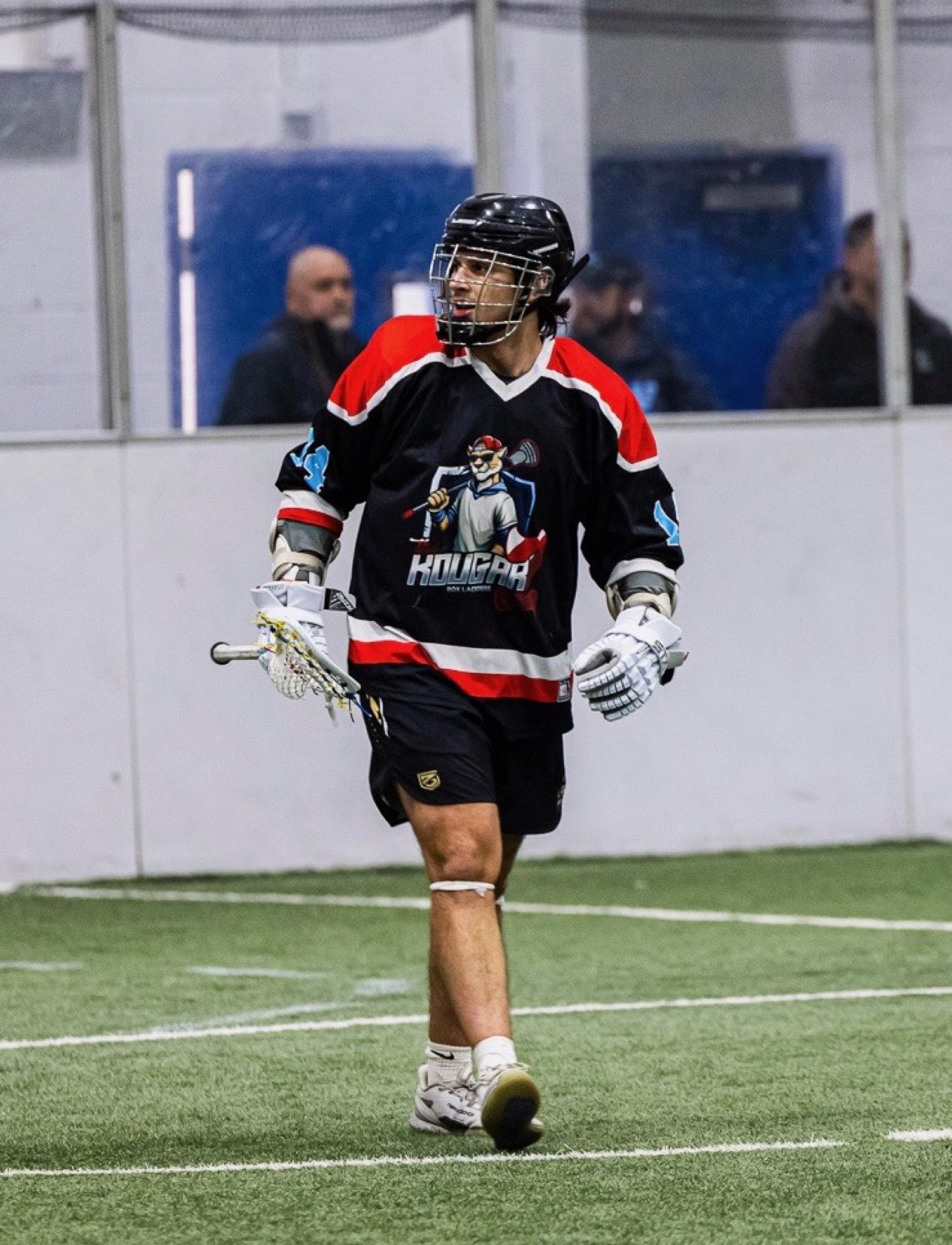Kougarz box lacrosse player in game action in Massachusetts