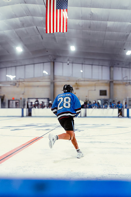 Kougarz players in action during box lacrosse game