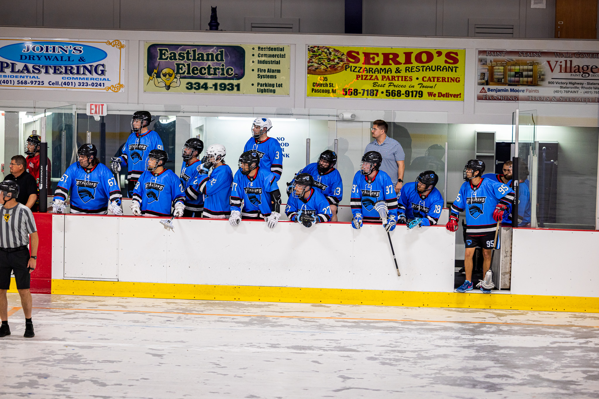 Kougarz team bench during a box lacrosse game