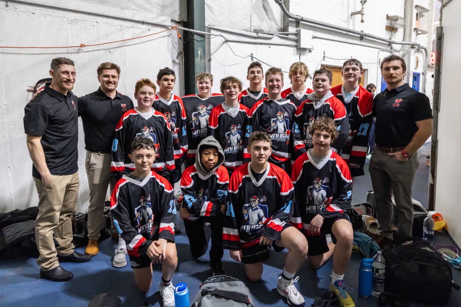 Kougarz box lacrosse team group photo with coaches